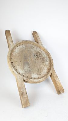 a small wooden chair with a wooden seat on a white surface