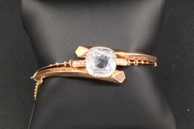 bracelet and ring set on a black cushion with a black background