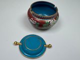 a small blue bowl and a small blue bowl on a white table