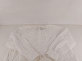 a white shirt that is on a white table