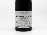 a bottle of wine that is sitting on a table