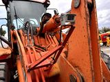 a tractor that is parked in a parking lot