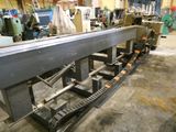 an image of a machine that is working on a piece of metal