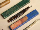 many different types of pens and pencils on the table