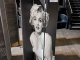 a black and white photo of a marilyn monroe on display