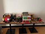 a table with a lot of bottles and cans on it