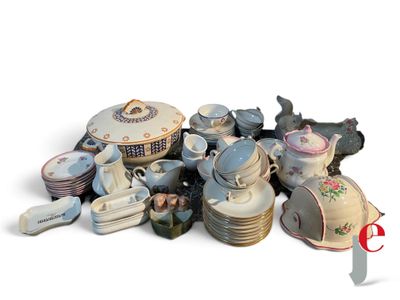 a pile of porcelain dishes and cups on a white surface