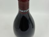a bottle of wine that is sitting on a table