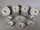 a lot of plates that are sitting on a table