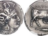 a close up of a coin with an image of a bull on it