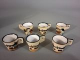six coffee mugs sitting on top of a table next to each other