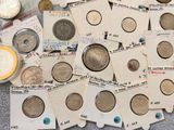 a lot of coins that are sitting on a table