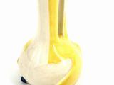 a small yellow and white duck next to a small yellow and white duck