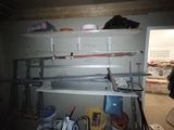 a shelf that has some tools on it in a room