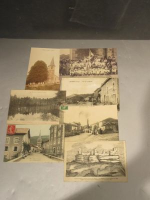 many pictures of old buildings on display in a glass case