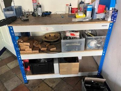a workbench with a lot of tools on top of it