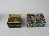 two small boxes that are sitting on a table