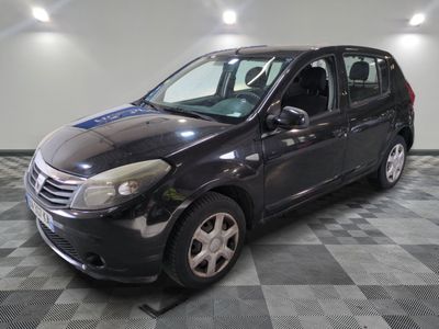 a picture of a small black car parked on a checkered floor