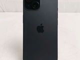 a close up of a black iphone sitting on a table
