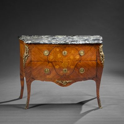 an antique chest of drawers with marble top