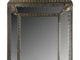 an ornately carved mirror with a gold frame on a white background