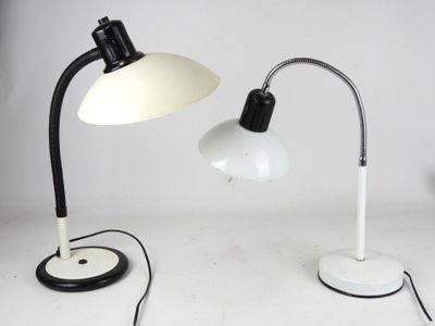 pair of black and white desk lamps on a white surface