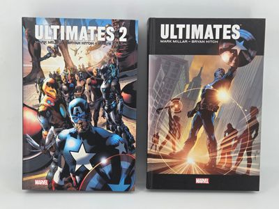 two books of ultimates 2 and ultimates 2 are on a table