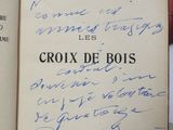 someone is holding a book with a handwritten poem on it
