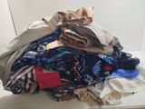 a pile of clothes that is on a table