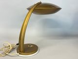 a close up of a lamp on a table with a cord