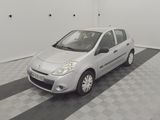 a picture of a small silver car parked in a garage