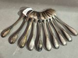 a lot of spoons that are sitting on a table