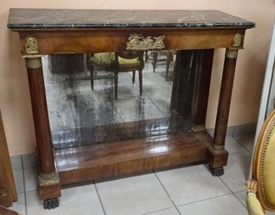 a table with a mirror on top of it in a room