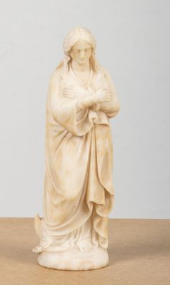 an image of a statue of a woman holding a baby