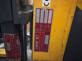 a close up of a parking meter with a sticker on it