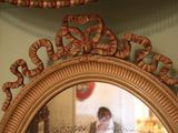 a reflection of a person in a mirror on the wall