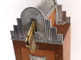 a wooden box that has a bunch of keys inside of it