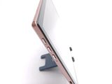 a close up of a tablet computer on a stand