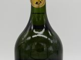 an image of a bottle of wine sitting on top of a table
