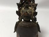 an old bronze statue of a man with a hat on his head