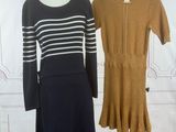 two dresses on a mannequin stand next to each other