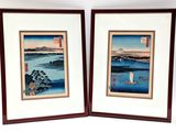 two framed prints of a couple of boats on a body of water