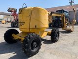 a large yellow machine that is parked in a parking lot