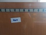 a sign that says kelvinator on the side of a door