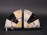 pair of black and white marble bookends on a black background