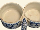 two cups that are sitting next to each other on a table