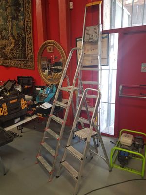 a ladder that is leaning against a wall in a room