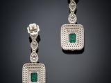 a pair of emerald and diamond earrings