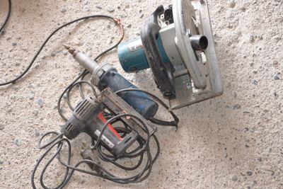 a picture of a corded sander and a sander on the ground