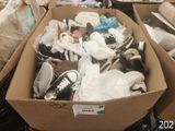 many boxes of shoes that are sitting on the floor